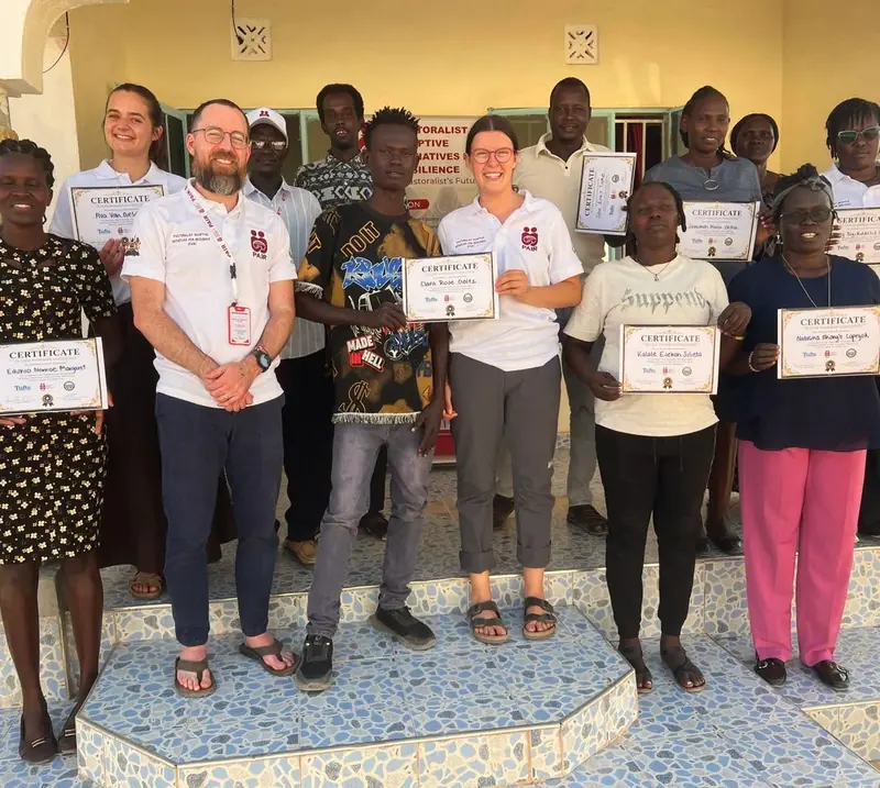 COHI workshop participants holding certificates.
