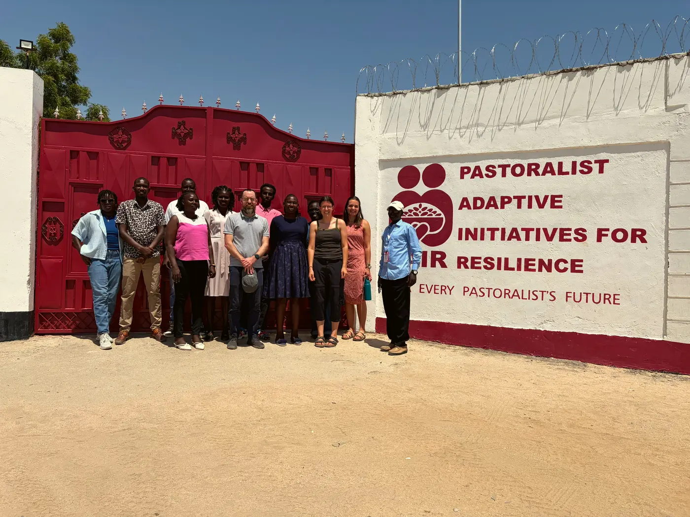 Participants of the first COHI workshop with PAIR staff outside the PAIR office gate in Lodwar.